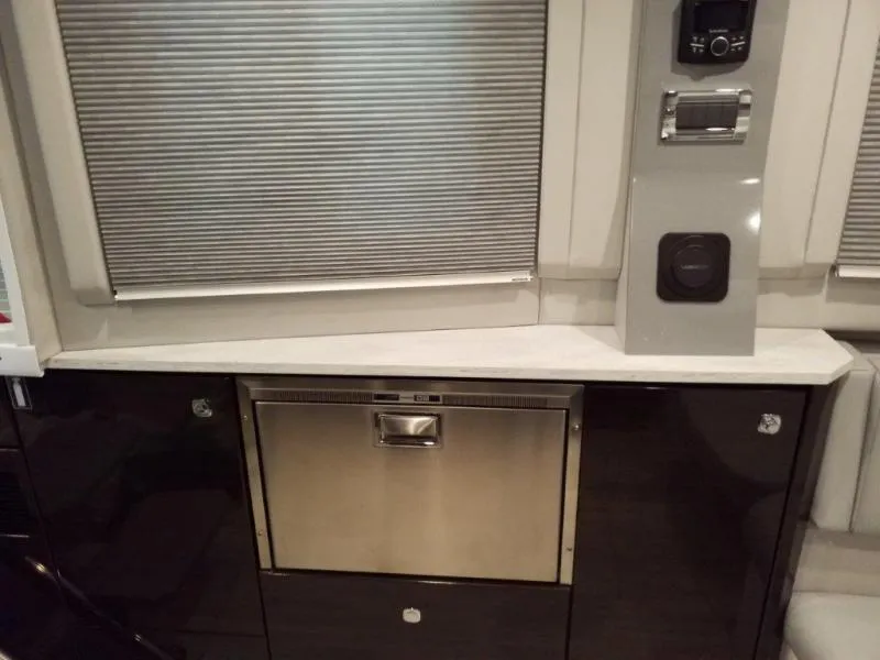 Slide: The Image of 2019 Formula 430 Super Sport Crossover interior with stainless steel appliances and modern design. - 13