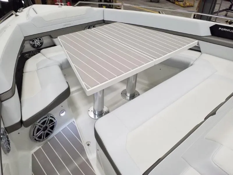 Slide: The Image of 2019 Formula 430 Super Sport Crossover boat interior with seating and table. - 14