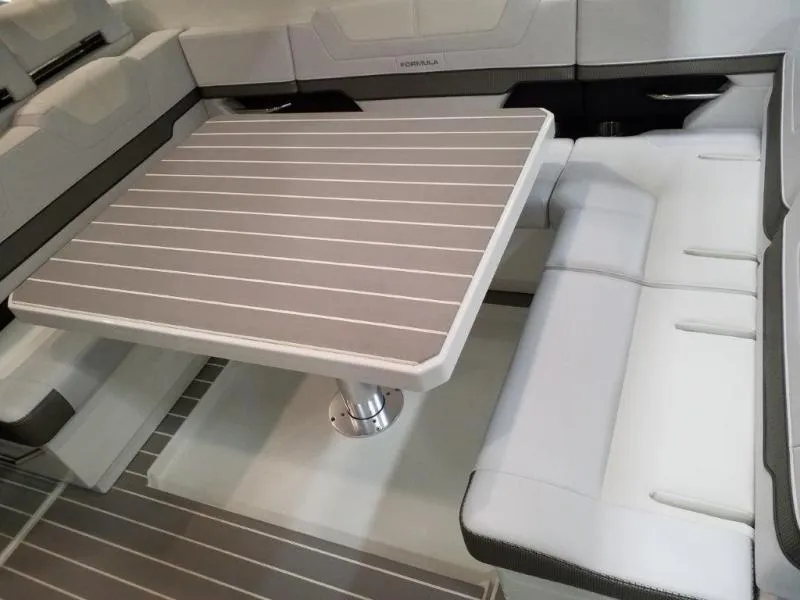 Slide: The Image of 2019 Formula 430 Super Sport Crossover interior with sleek seating and table design. - 16