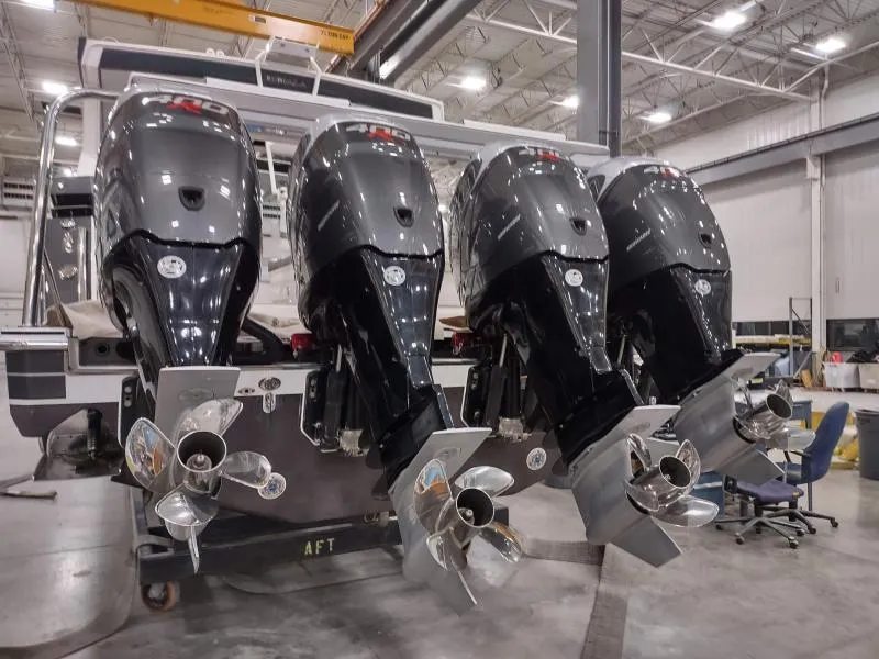 Slide: The Image of 2019 Formula 430 Super Sport Crossover with four powerful outboard engines in a workshop. - 17