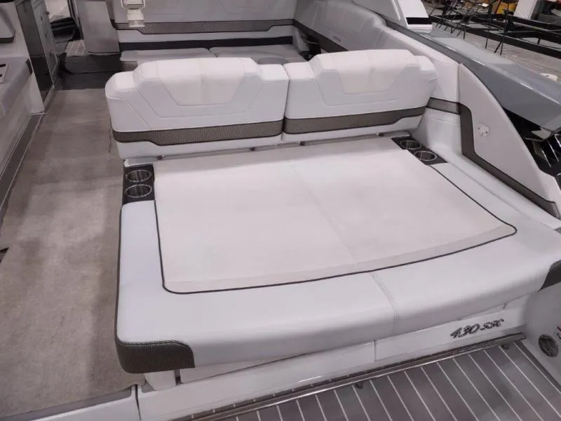 Slide: The Image of 2019 Formula 430 Super Sport Crossover boat interior with spacious seating and cup holders. - 18
