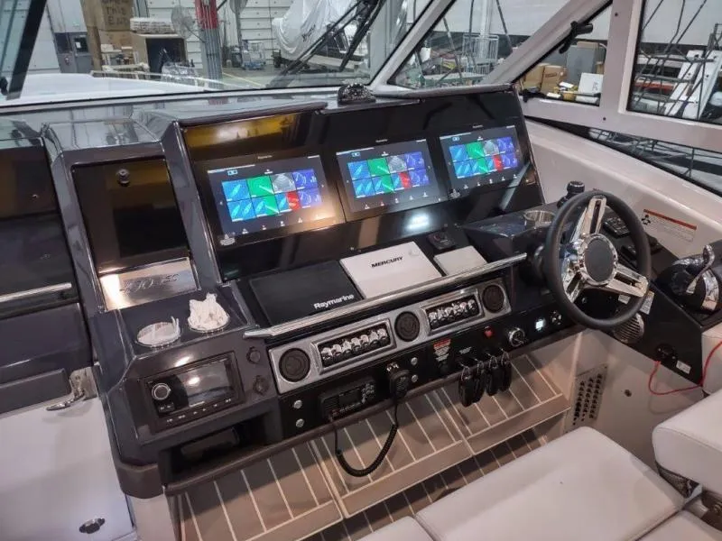 Slide: The Image of 2019 Formula 430 Super Sport Crossover helm with advanced navigation displays and controls. - 23