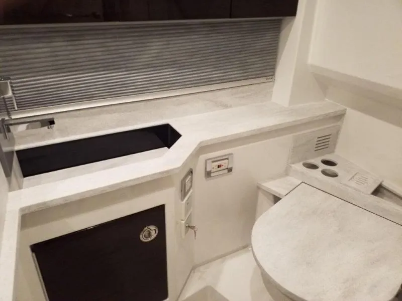 Slide: The Image of 2019 Formula 430 Super Sport Crossover interior with modern kitchen and sleek design. - 9