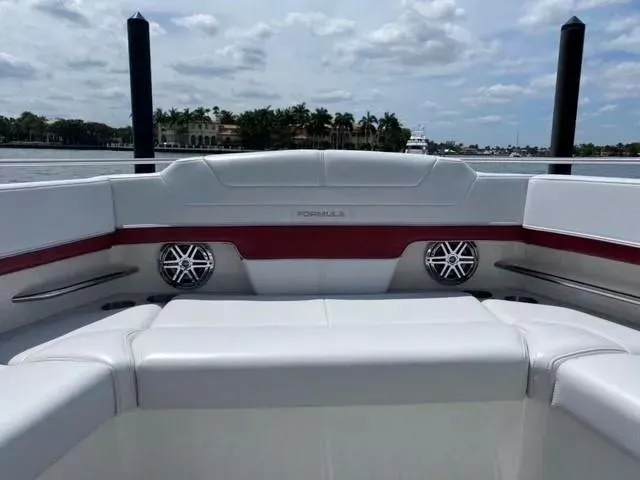Slide: The Image of 2020 Formula 430 Super Sport Crossover boat interior with plush seating and speakers. - 11