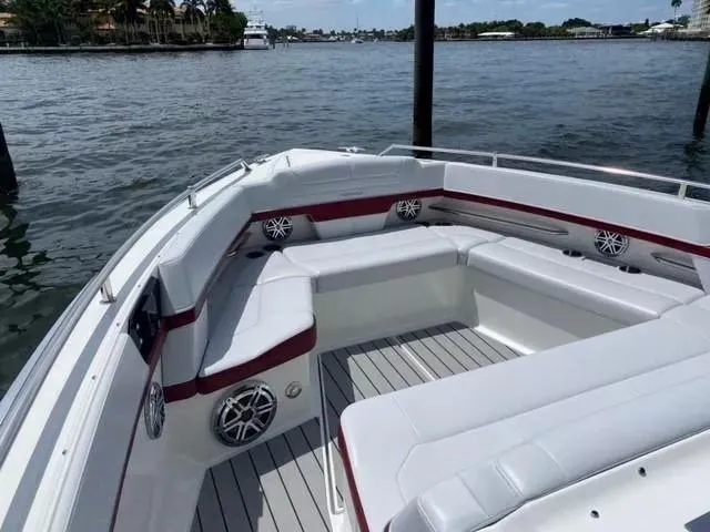 Slide: The Image of 2020 Formula 430 Super Sport Crossover boat with spacious seating on calm water. - 12