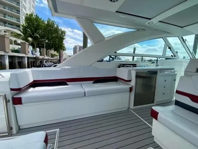 Slide: The Image of 2020 Formula 430 Super Sport Crossover yacht interior with sleek seating and modern amenities. - 13