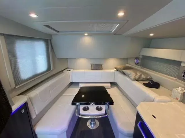 Slide: The Image of Luxurious interior of 2020 Formula 430 Super Sport Crossover yacht with modern seating and lighting. - 15