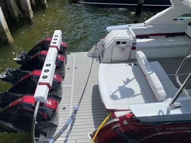 Slide: The Image of 2020 Formula 430 Super Sport Crossover boat with multiple outboard engines docked. - 16