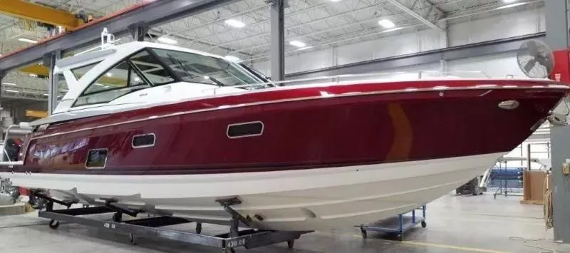 Slide: The Image of 2020 Formula 430 Super Sport Crossover boat in a showroom, side view. - 2