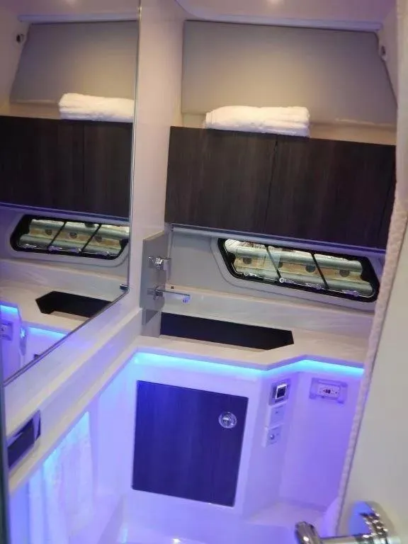 Slide: The Image of Interior of 2020 Formula 430 Super Sport Crossover with modern design and ambient lighting. - 24