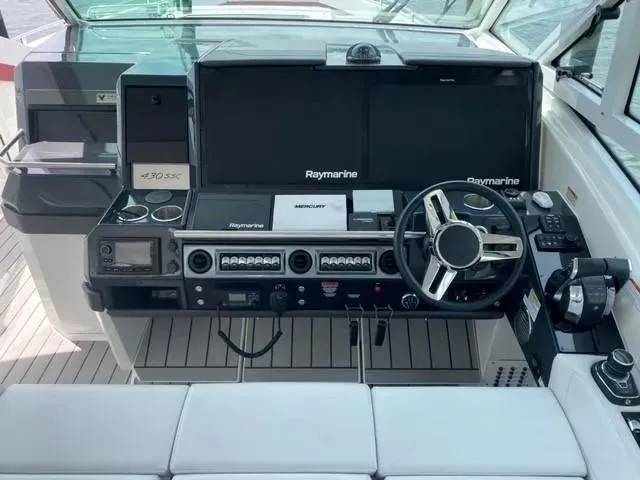 Slide: The Image of 2020 Formula 430 Super Sport Crossover helm with Raymarine electronics and modern controls. - 7