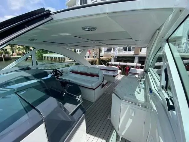 Slide: The Image of 2020 Formula 430 Super Sport Crossover yacht interior with sleek design and spacious seating. - 9