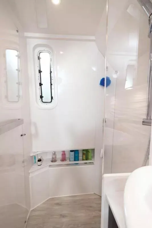 Slide: The Image of Interior of 2025 Formula 457 Center Console Sport boat bathroom with modern fixtures. - 16