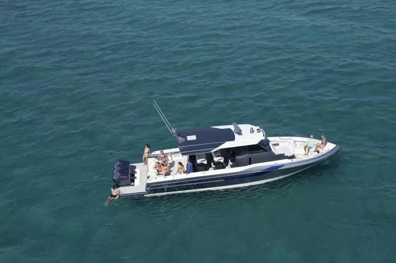 Slide: The Image of 2025 Formula 457 Center Console Sport boat on open water with passengers enjoying the ride. - 3