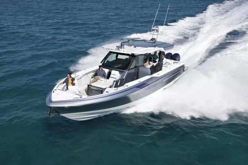 Slide: The Image of 2025 Formula 457 Center Console Sport boat cruising on open water. - 4