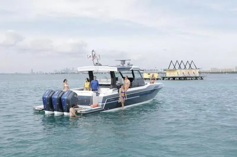 Slide: The Image of 2025 Formula 457 Center Console Sport boat with people enjoying the water. - 6