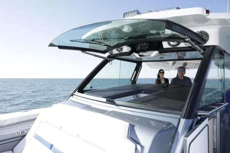 Slide: The Image of 2025 Formula 457 Center Console Sport boat cruising on open water. - 7