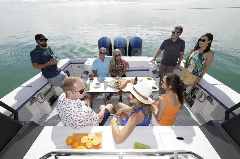 Slide: The Image of Group enjoying a day on a 2025 Formula 457 Center Console Sport boat. - 9