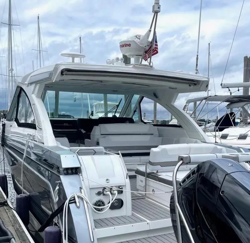 Slide: The Image of 2023 Formula 380 Super Sport Crossover OB docked at marina, rear view. - 6