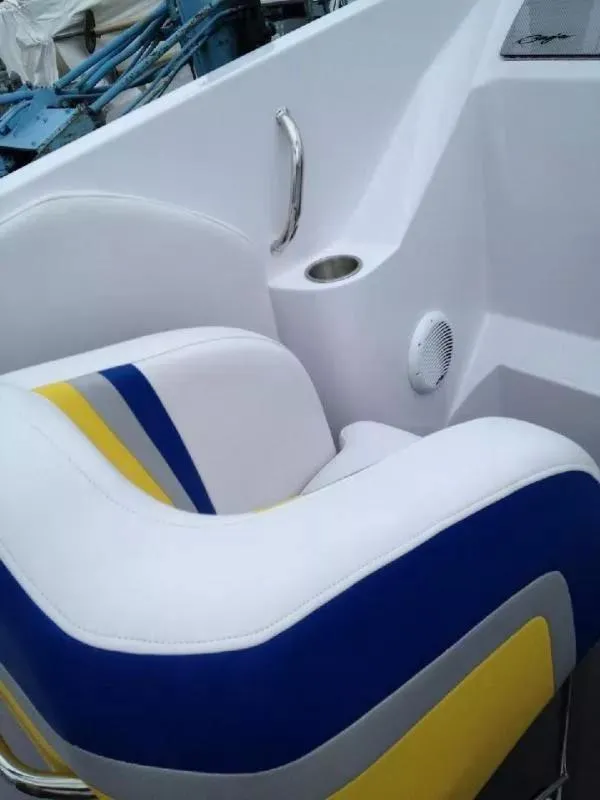 Slide: The Image of 2014 Baja 35 Outlaw boat seat with blue, yellow, and white upholstery. - 13