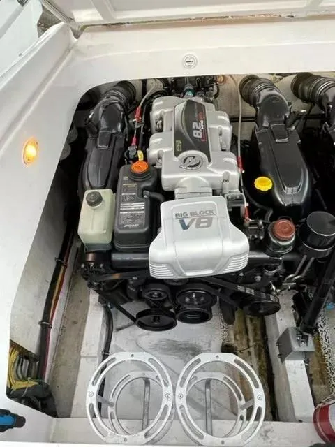 Slide: The Image of Engine compartment of a 2014 Baja 35 Outlaw boat featuring a powerful V8 engine. - 7
