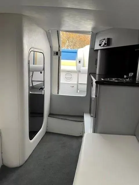 Slide: The Image of 2014 Baja 35 Outlaw interior with kitchenette and seating area. - 9