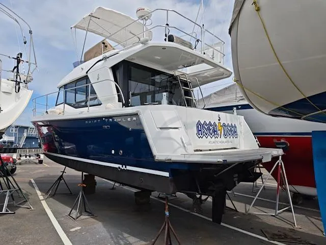 Slide: The Image of 2017 Beneteau Swift Trawler 30 on stands in a boatyard. - 15
