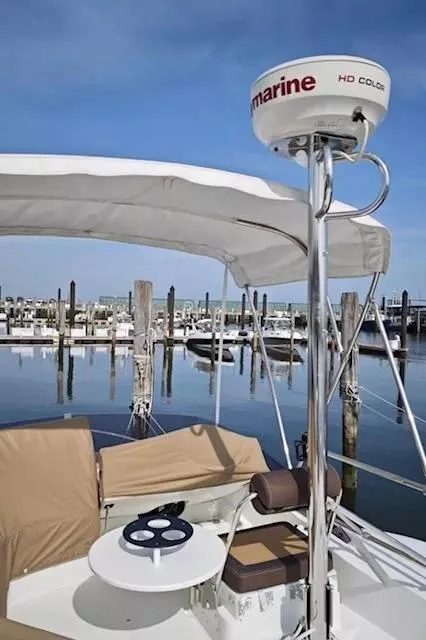 Slide: The Image of 2017 Beneteau Swift Trawler 30 at marina with radar and seating area. - 20