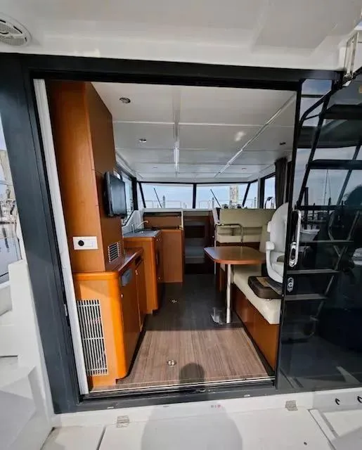 Slide: The Image of Interior view of 2017 Beneteau Swift Trawler 30, featuring modern furnishings and navigation area. - 23