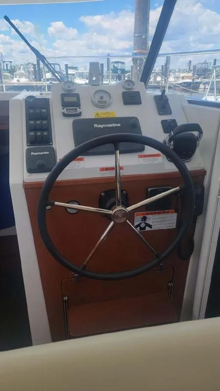 Slide: The Image of 2017 Beneteau Swift Trawler 30 helm with Raymarine navigation system. - 8