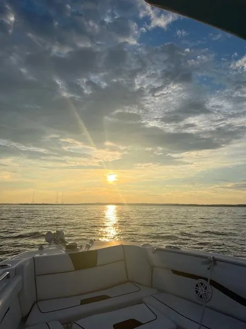 Slide: The Image of 2022 Wellcraft 262 Fisherman boat at sunset on calm waters. - 10