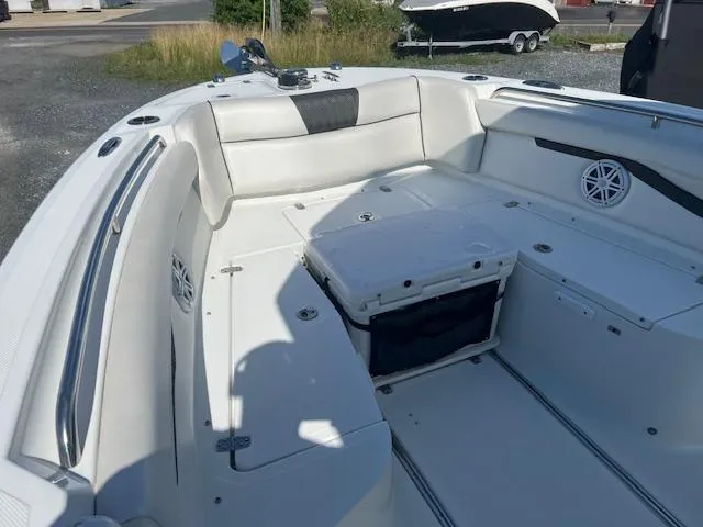 Slide: The Image of 2022 Wellcraft 262 Fisherman boat interior with seating and storage compartments. - 13