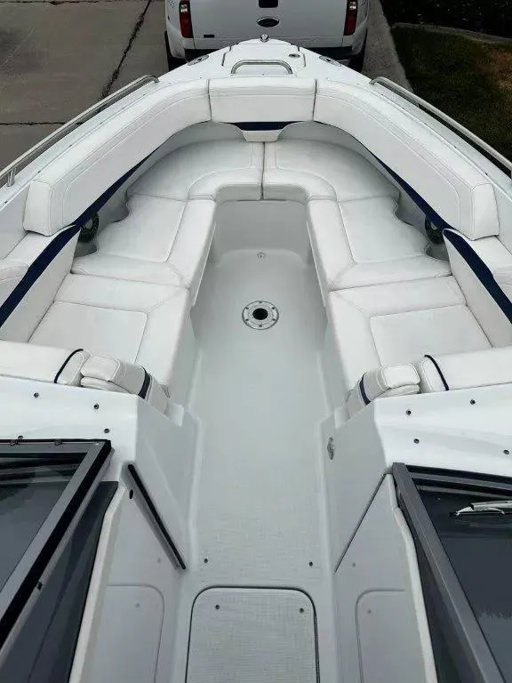 Slide: The Image of 2013 Formula 270 Bowrider boat interior with white seating and open deck. - 11