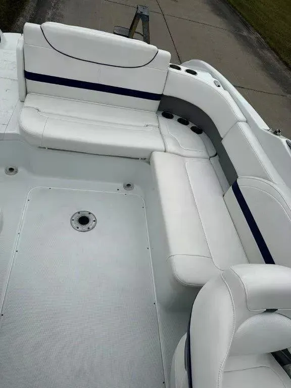Slide: The Image of 2013 Formula 270 Bowrider interior with white seating and blue accents. - 13