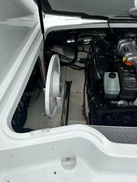 Slide: The Image of Engine compartment of a 2013 Formula 270 Bowrider boat, showcasing mechanical components. - 17