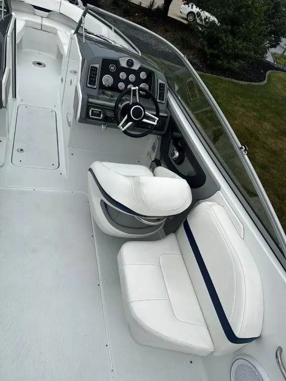 Slide: The Image of 2013 Formula 270 Bowrider interior with white seating and modern dashboard. - 8