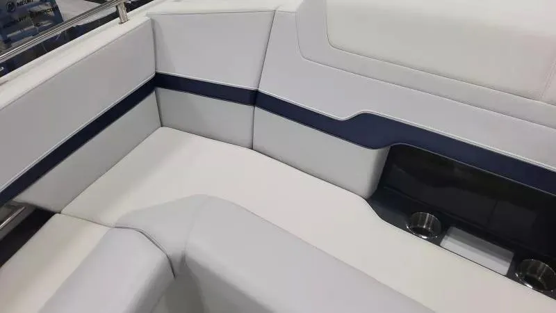Slide: The Image of 2024 Formula 380 Super Sport Crossover OB interior seating with sleek white and navy design. - 18