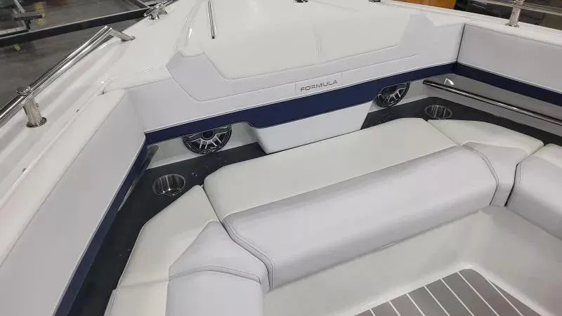 Slide: The Image of 2024 Formula 380 Super Sport Crossover OB interior with white seating and cup holders. - 21