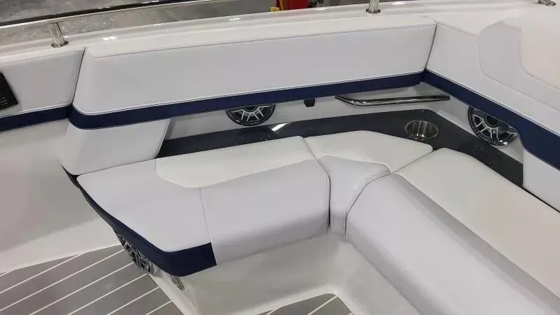 Slide: The Image of 2024 Formula 380 Super Sport Crossover OB interior seating with white and navy accents. - 22