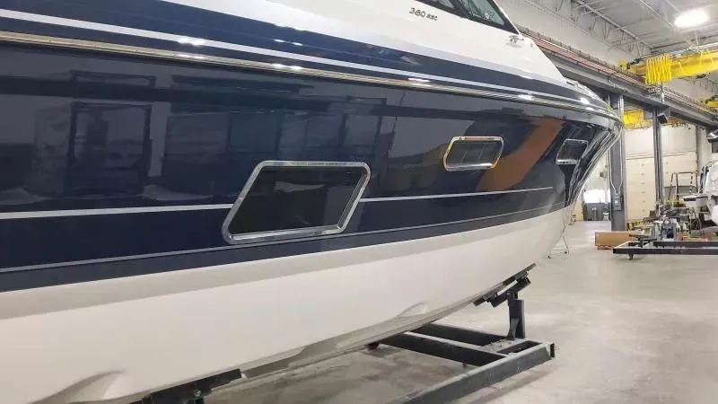 Slide: The Image of 2024 Formula 380 Super Sport Crossover OB boat in a workshop setting. - 4