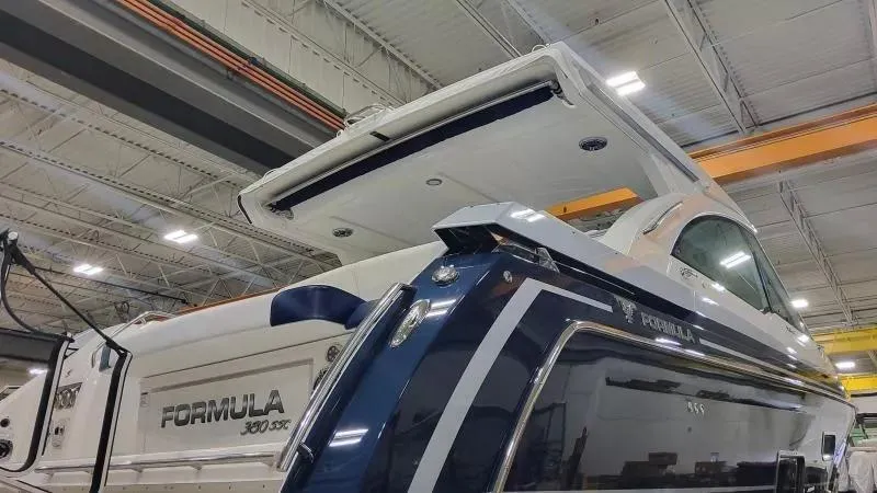 Slide: The Image of 2024 Formula 380 Super Sport Crossover OB in a showroom, showcasing sleek design and modern features. - 6