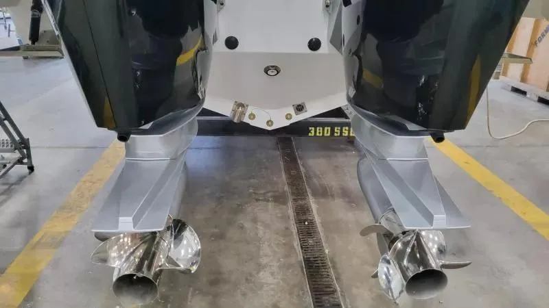 Slide: The Image of 2025 Formula 380 Super Sport Crossover OB boat engines in a workshop setting. - 10