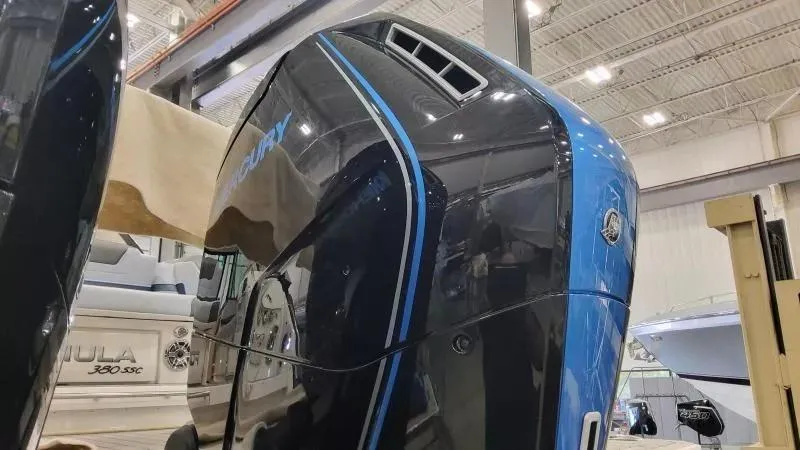 Slide: The Image of 2025 Formula 380 Super Sport Crossover OB in showroom, featuring sleek design and powerful outboard engine. - 11