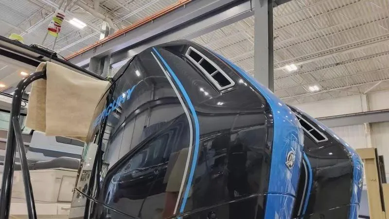 Slide: The Image of 2025 Formula 380 Super Sport Crossover OB in a showroom, showcasing sleek design and blue accents. - 12