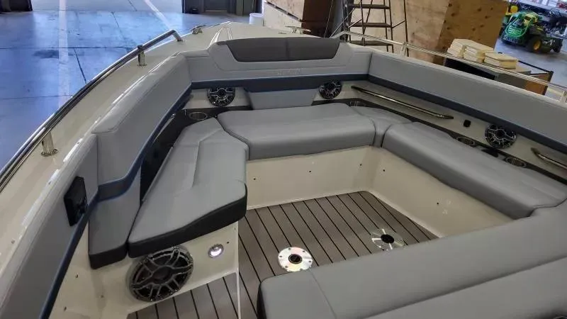 Slide: The Image of 2025 Formula 380 Super Sport Crossover OB boat interior with gray seating and modern design. - 16