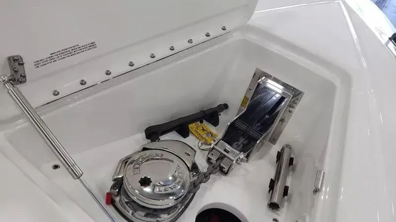 Slide: The Image of 2025 Formula 380 Super Sport Crossover OB anchor compartment with winch and accessories. - 17