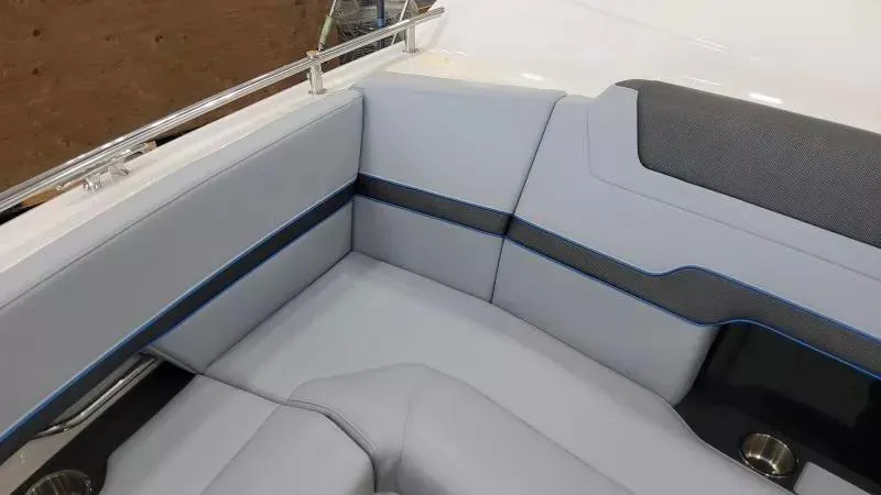 Slide: The Image of 2025 Formula 380 Super Sport Crossover OB boat interior with sleek gray seating. - 20
