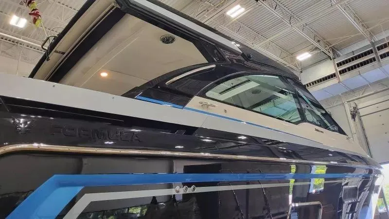 Slide: The Image of 2025 Formula 380 Super Sport Crossover OB in showroom, showcasing sleek design and modern features. - 7