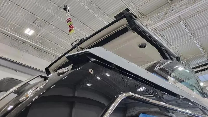 Slide: The Image of 2025 Formula 380 Super Sport Crossover OB boat in showroom, showcasing sleek design and modern features. - 8