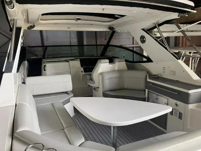 Slide: The Image of 2020 Sea Ray Sundancer 320 OB interior with sleek seating and modern amenities. - 10